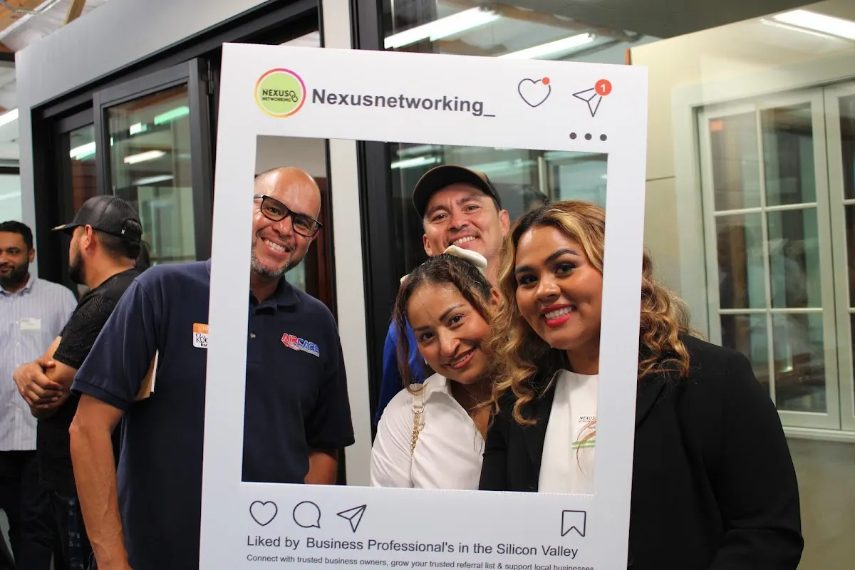 Nexus Networking members posing with the Instagram photo frame